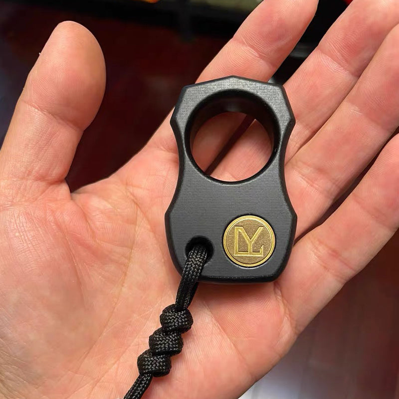 Non-metallic brass knuckle keychain